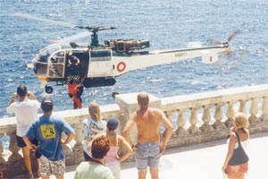 Tourists look on as an AFM rescuer and one of the divers are winched aboard an Aloutte helicopter at Wied iz-Zurrieq. Picture: George Miller